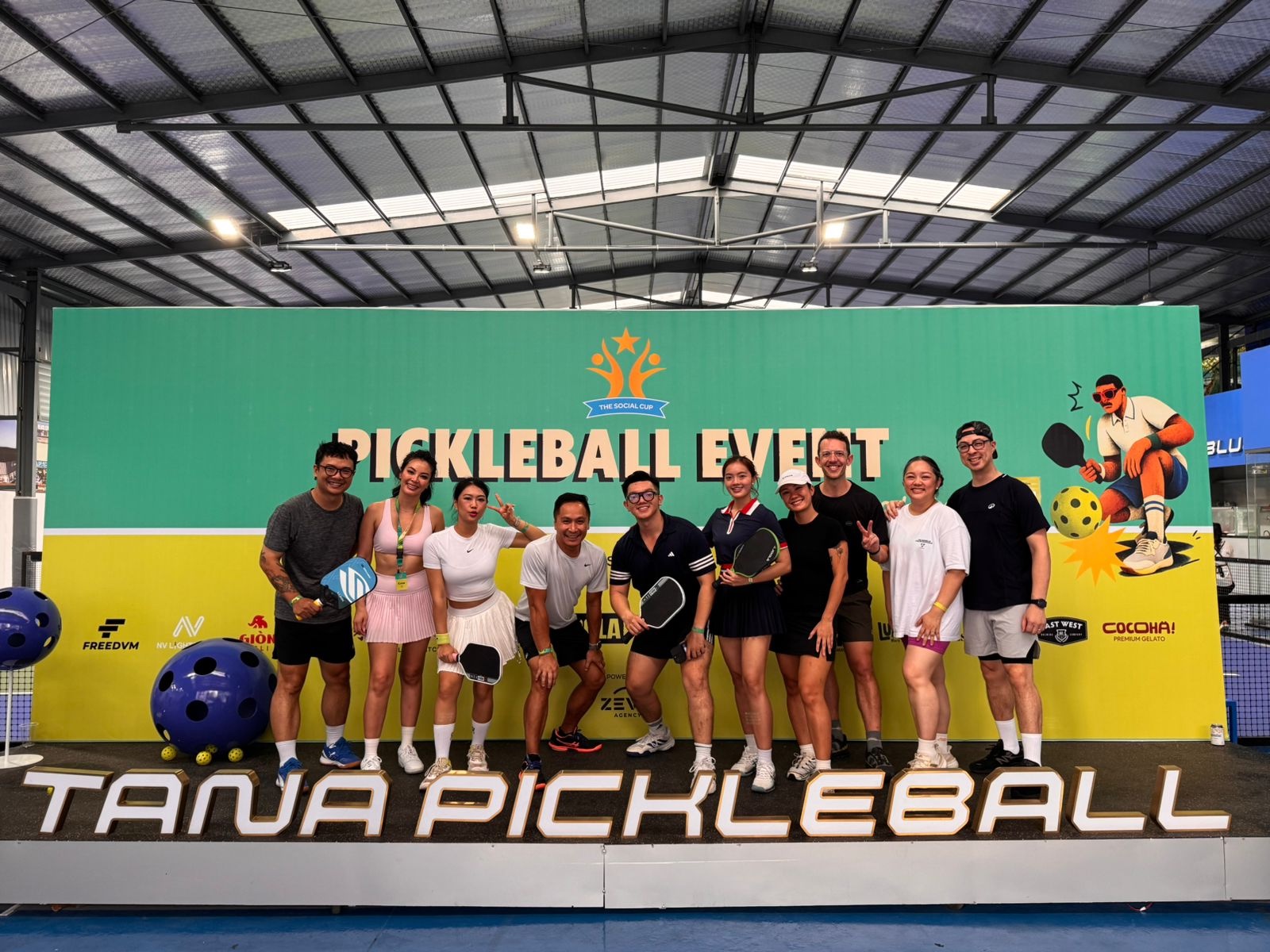 Local pickleball players with their paddles at a Saigon event